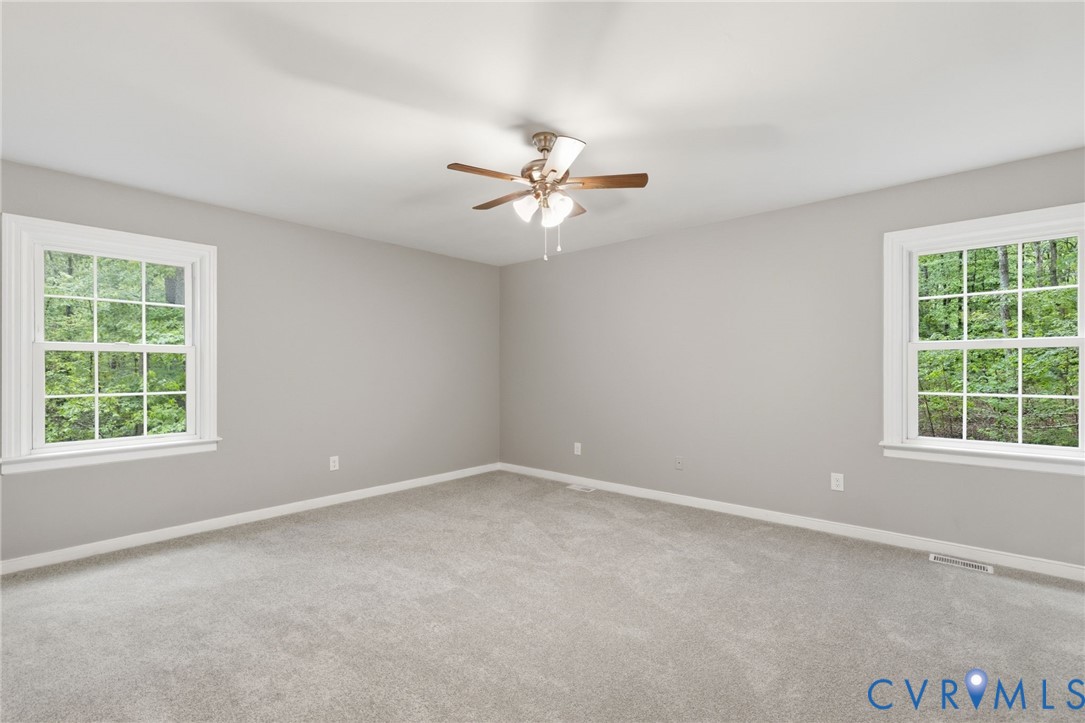 10731 Spring Run Road Chesterfield, VA 23832 - Photo 20 of 33 an empty room with a window and a fan