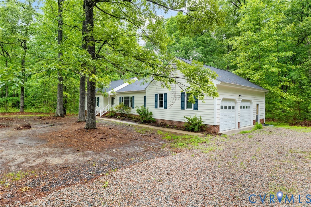 10731 Spring Run Road Chesterfield, VA 23832 - Photo 2 of 33 a view of a house with a yard and large trees