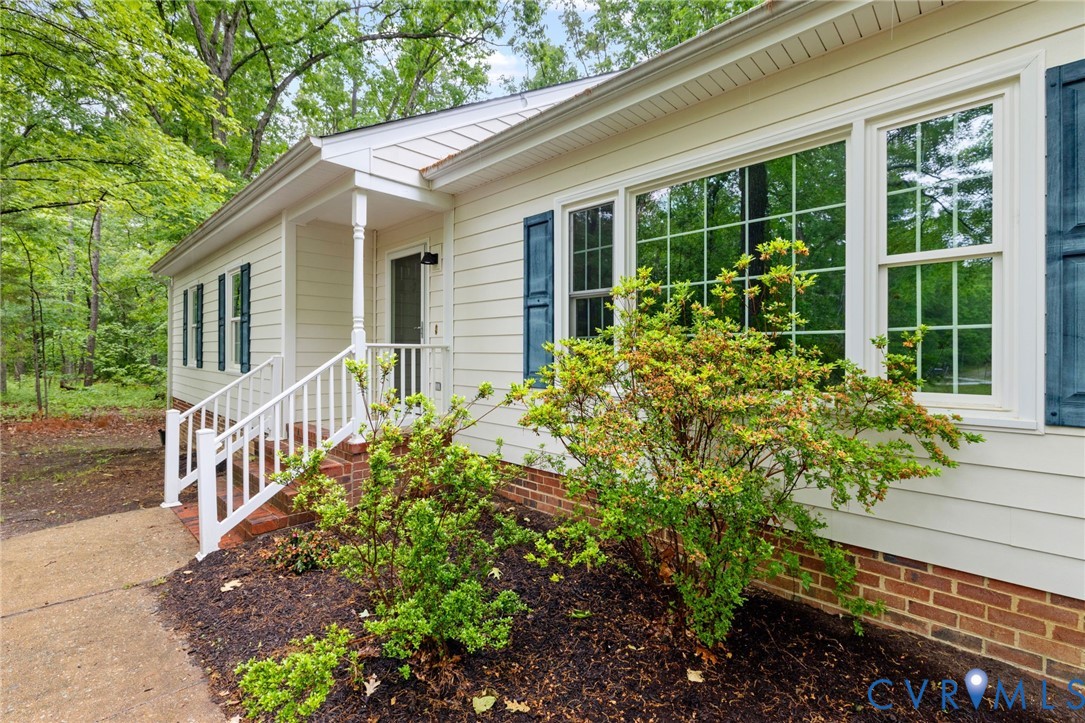 10731 Spring Run Road Chesterfield, VA 23832 - Photo 3 of 33 a front view of a house with a yard