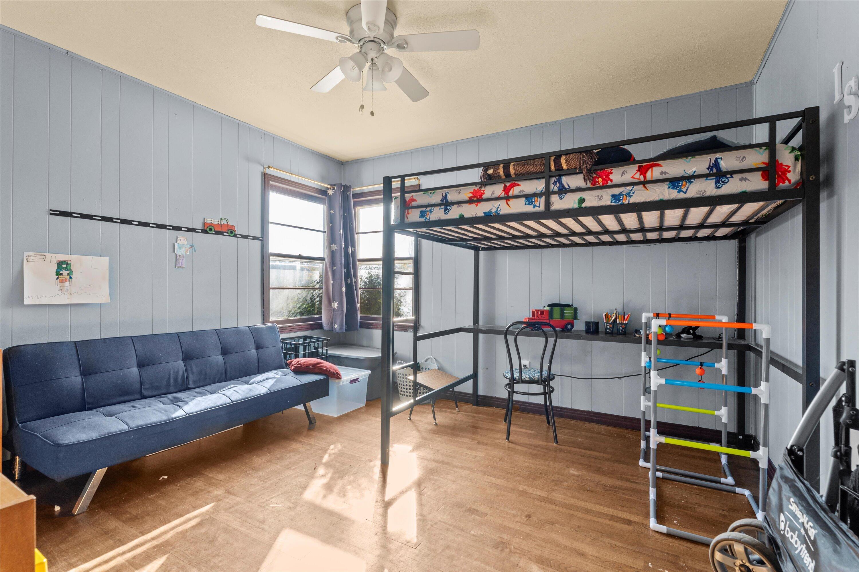 1915 37th Street Lubbock, TX 79412 - Photo 11 of 20 a living room with lots of furniture and a wooden floor