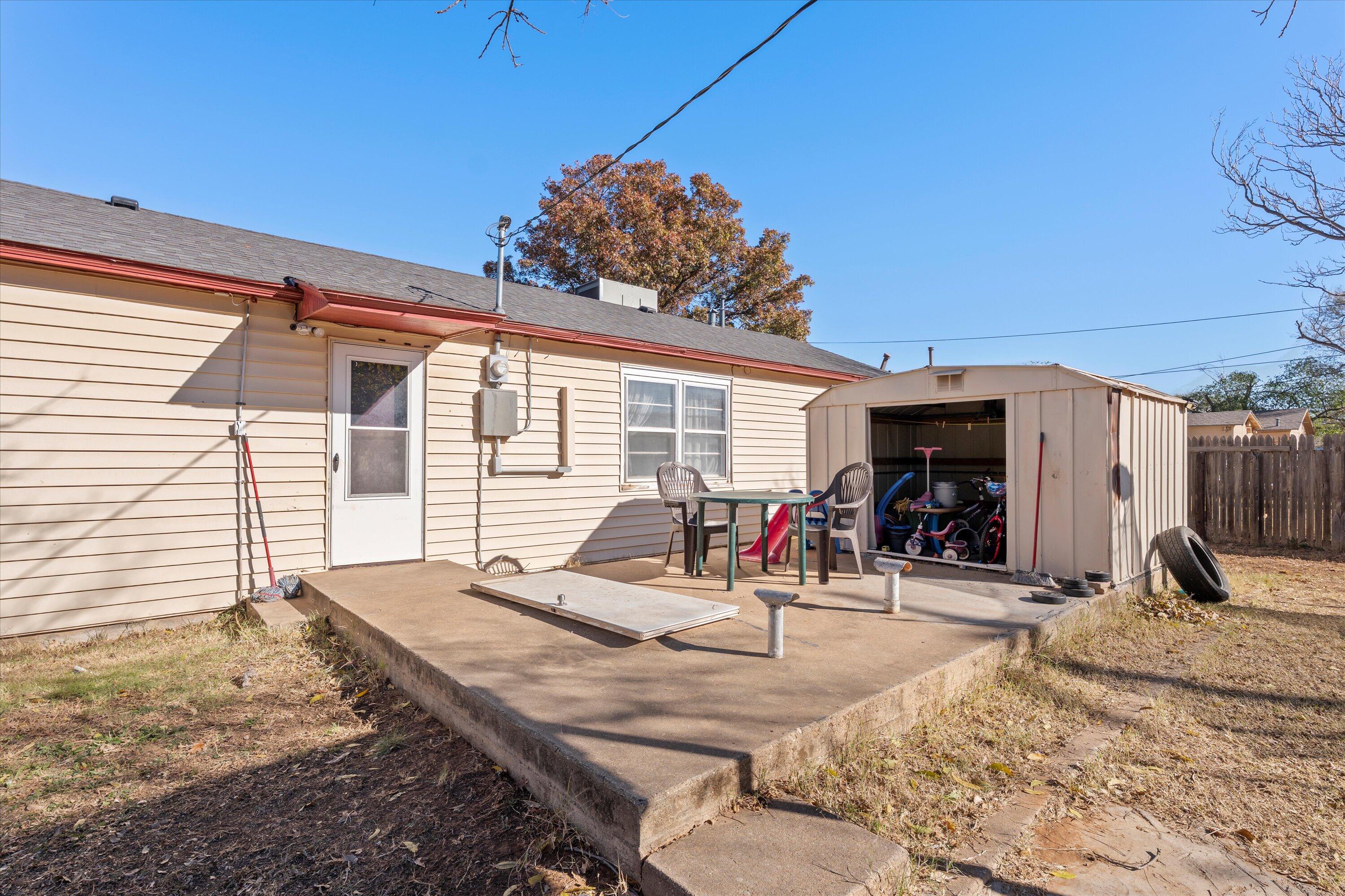 1915 37th Street Lubbock, TX 79412 - Photo 16 of 20 a view of a dinning table and chairs in patio