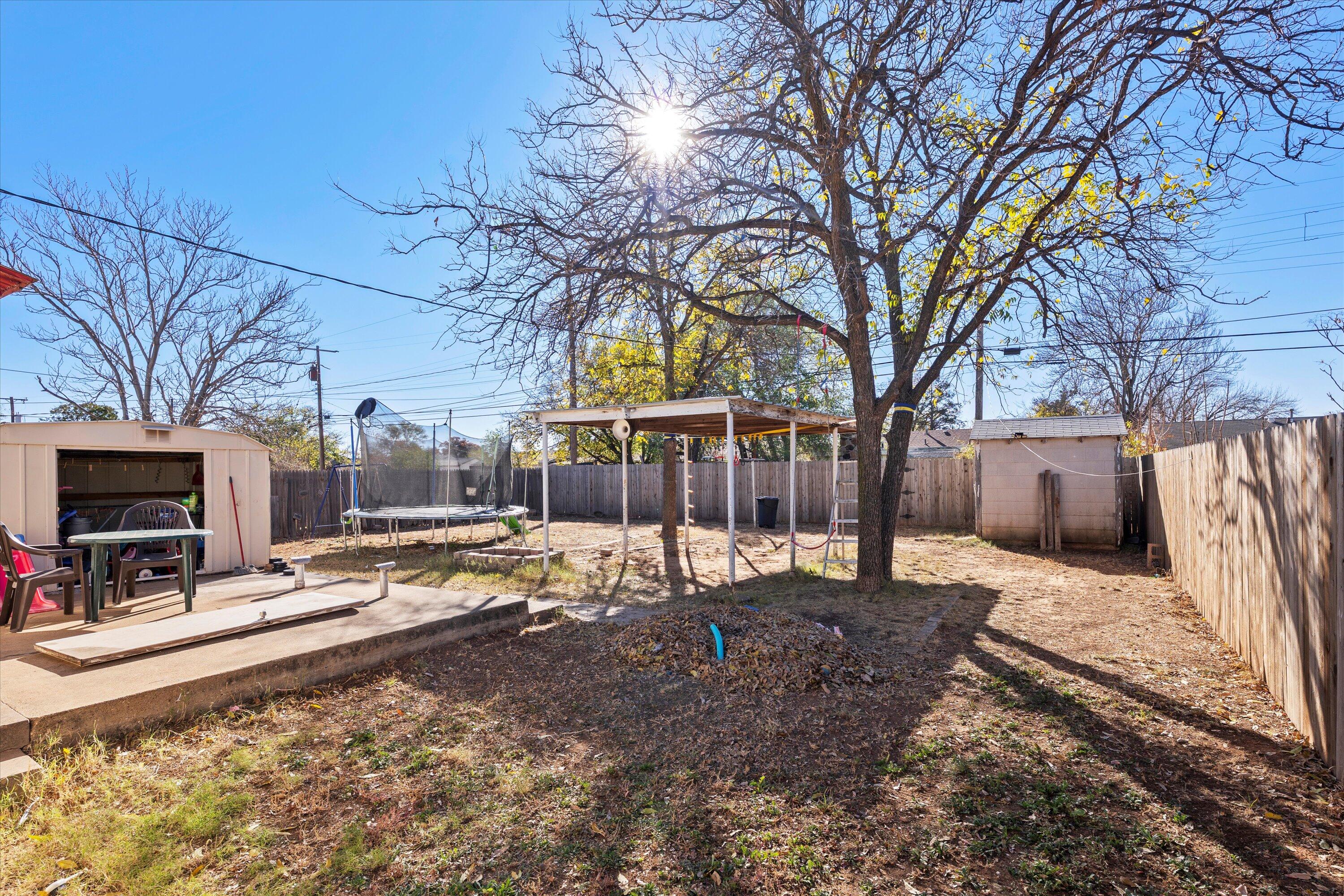 1915 37th Street Lubbock, TX 79412 - Photo 18 of 20 a view of a yard covered in snow