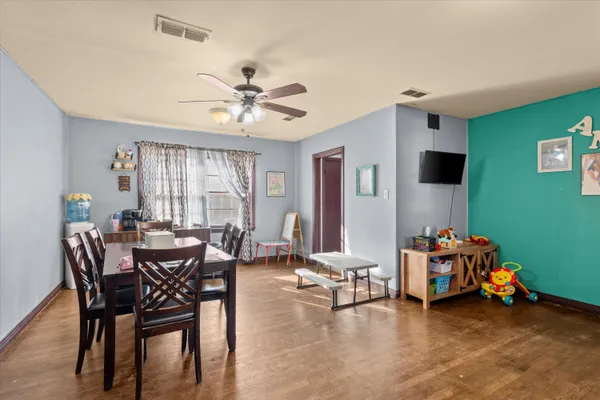 a view of a livingroom with furniture and a window