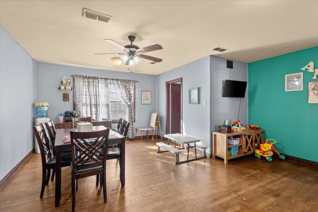a view of a livingroom with furniture and a window