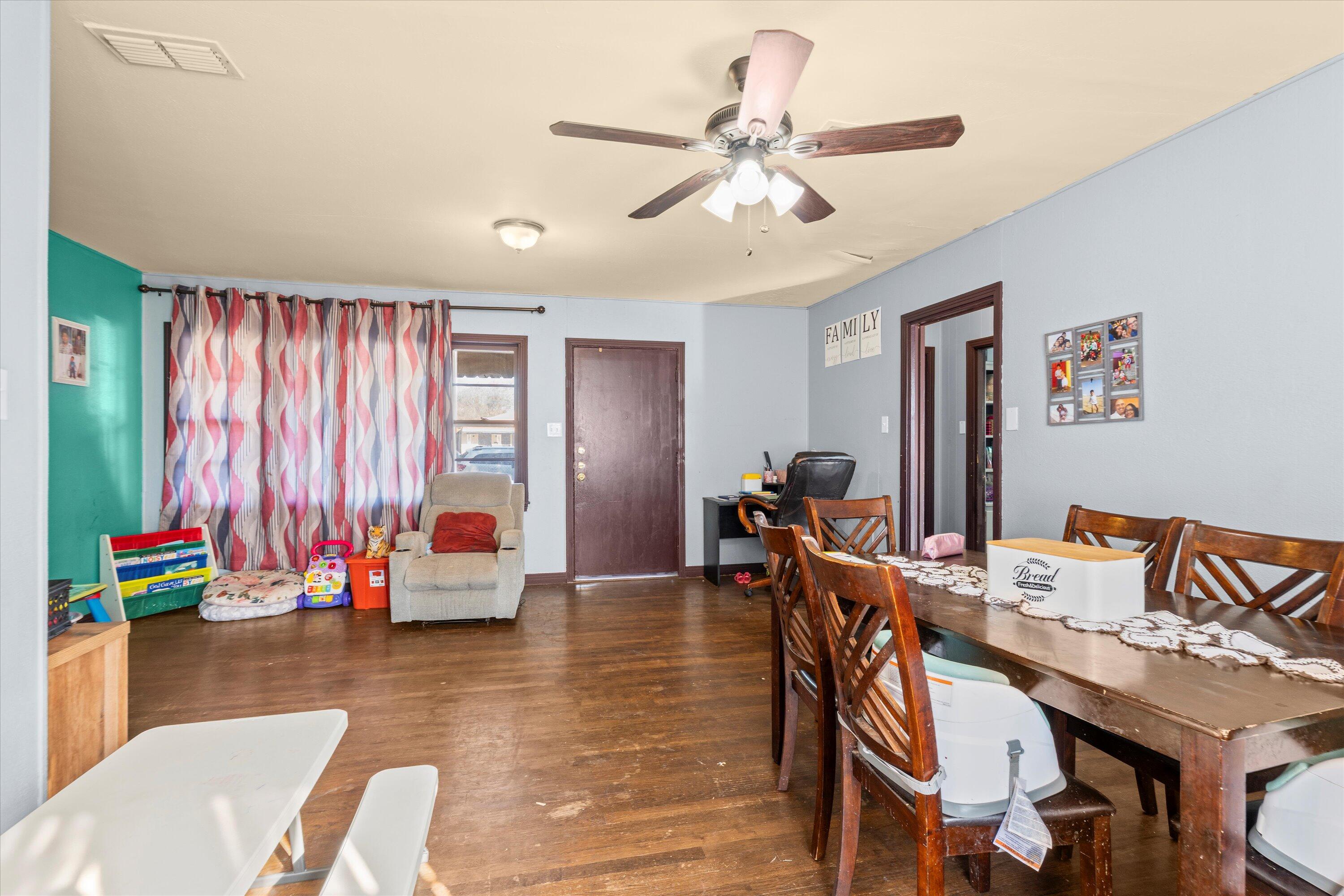 1915 37th Street Lubbock, TX 79412 - Photo 6 of 20 a view of a dining room with furniture window and outside view