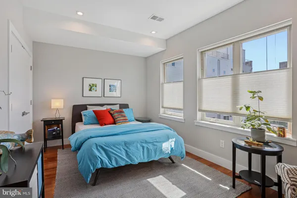 a bedroom with a bed and a table in it