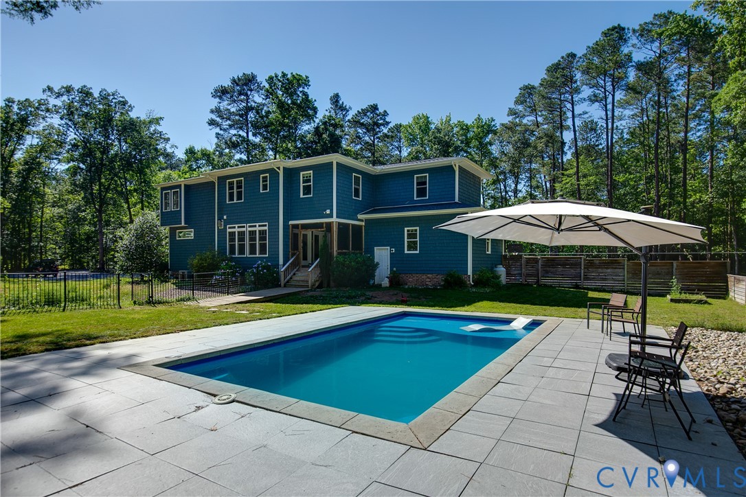 9749 Hoke Brady Road Henrico, VA 23231 - Photo 43 of 53 a view of a swimming pool with lounge chairs in the patio