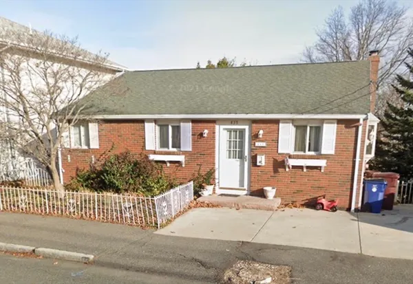front view of a house with a fence