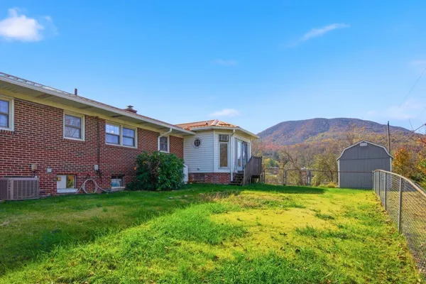 a view of a house with a big yard
