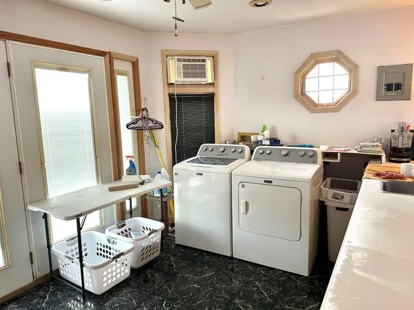 a utility room with dryer and washer