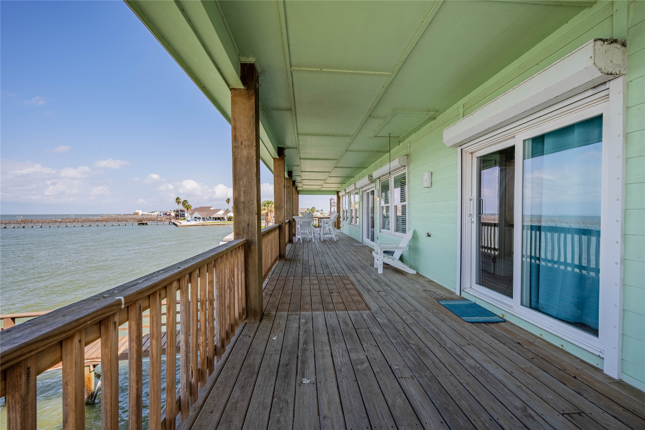 740 Copano Cove Road Rockport, TX 78382 - Photo 12 of 35 a view of a balcony with wooden floor
