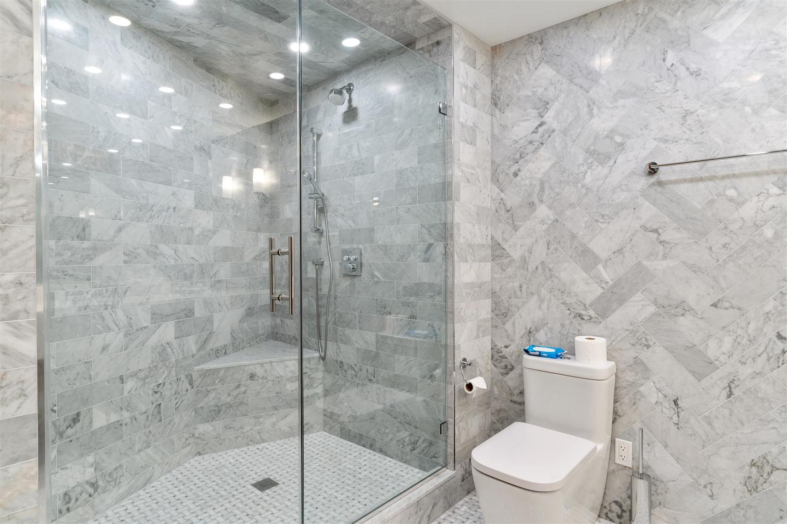 680 North Lake Shore Drive, Unit 1103 Chicago, IL 60611 - Photo 22 of 28 a bathroom with a toilet and a shower