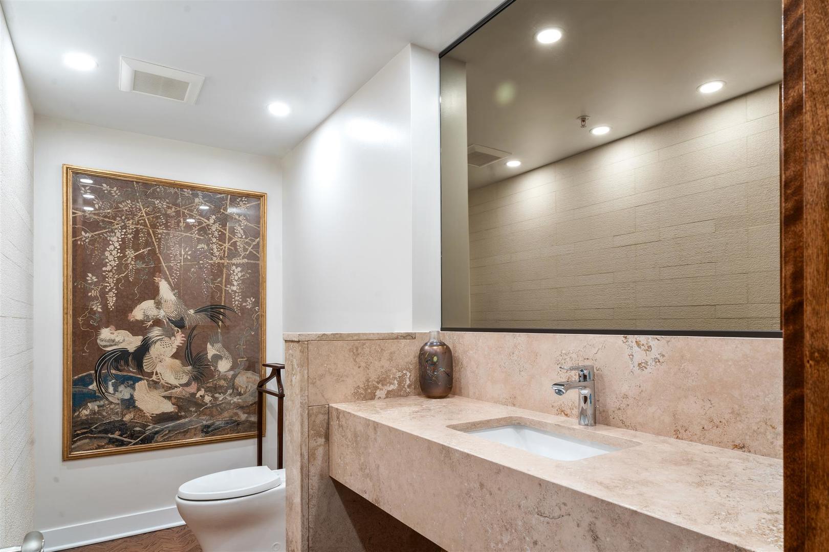 680 North Lake Shore Drive, Unit 1103 Chicago, IL 60611 - Photo 8 of 28 a bathroom with a granite countertop sink a toilet a large mirror and shower