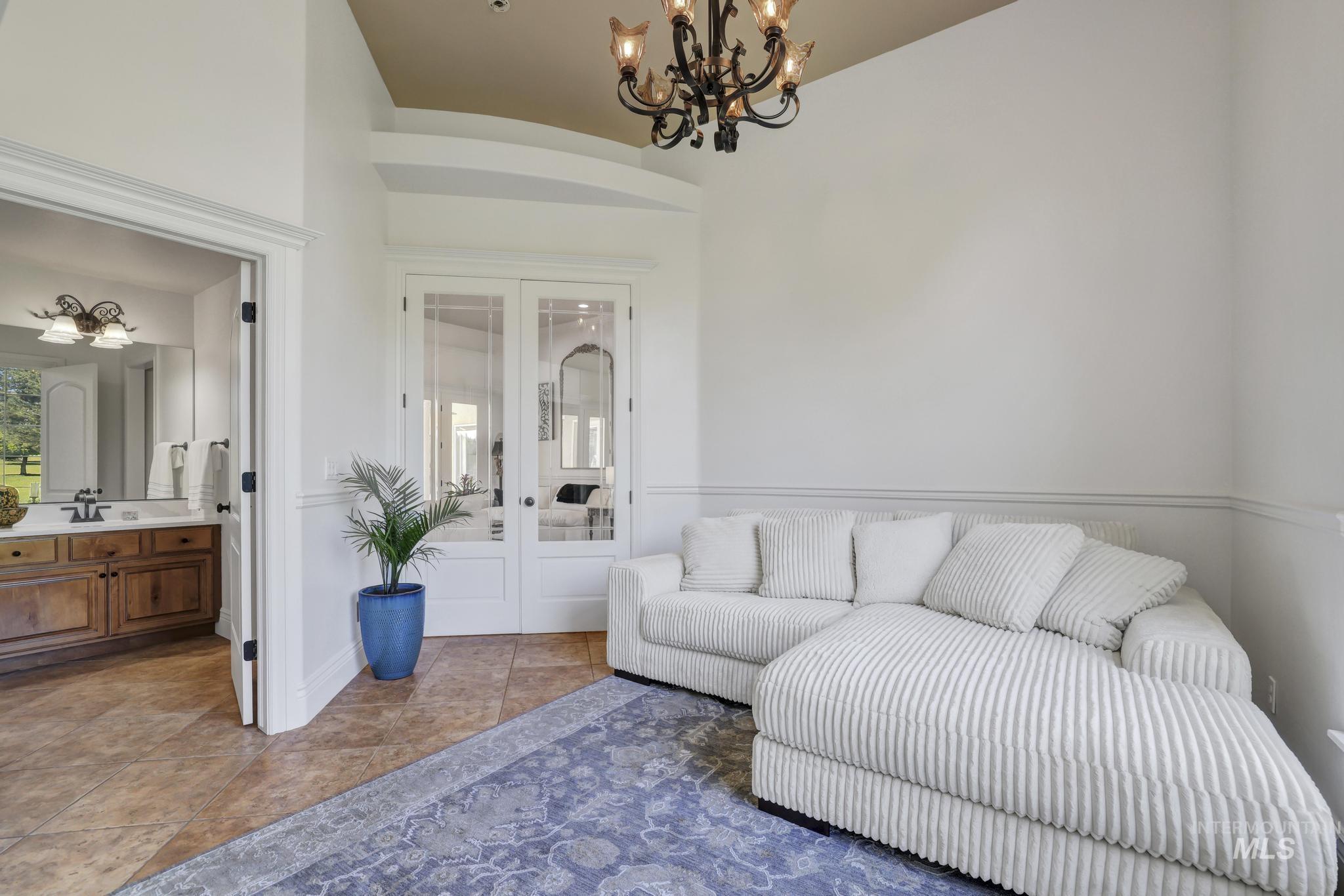 1301 Kanaka Rapids Road Buhl, ID 83316 - Photo 13 of 50 Recessed ceiling with an ornate chandelier
