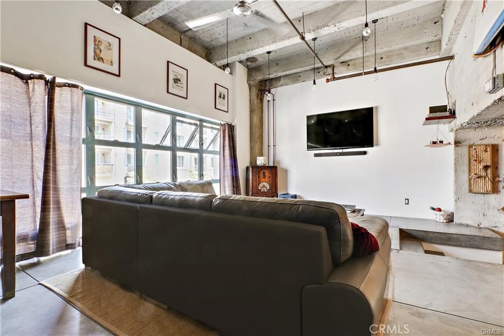 100 West 5th Street, Unit 2G Long Beach, CA 90802 - Photo 7 of 17 a living room with furniture and a flat screen tv