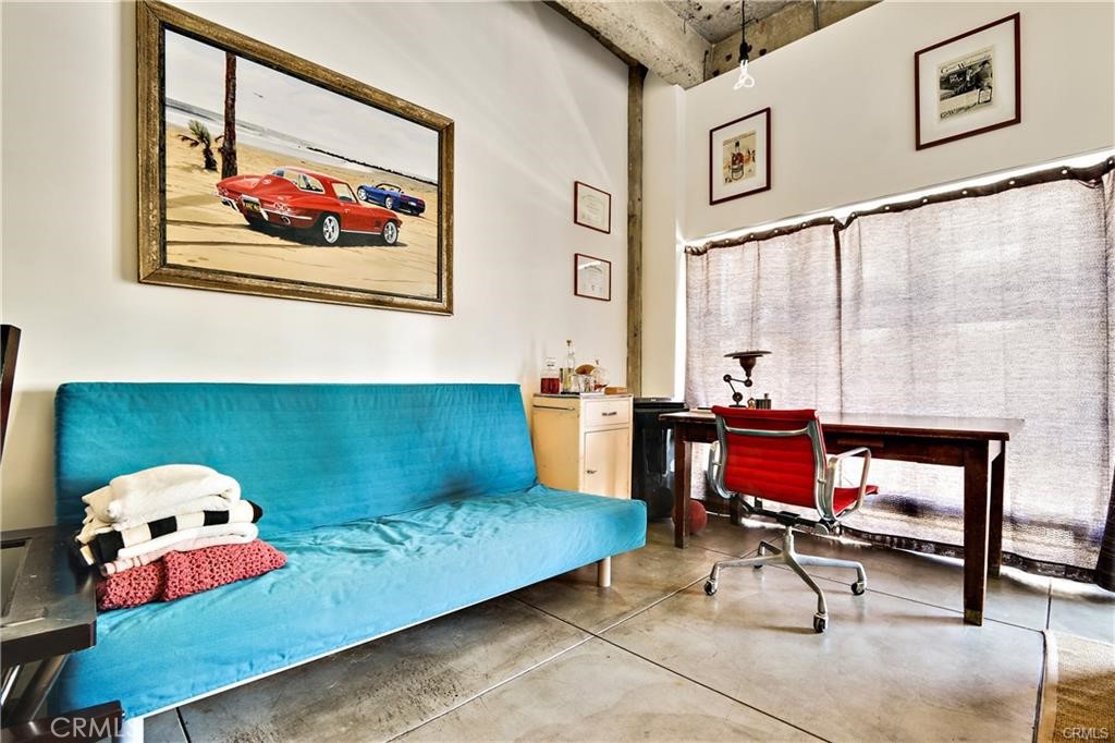 100 West 5th Street, Unit 2G Long Beach, CA 90802 - Photo 8 of 17 a living room with furniture rug and wall paintings