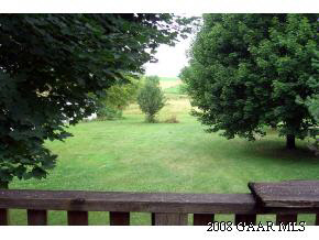 614 Battlefield Road New Hope, VA 24437 - Photo 4 of 12 a view of backyard with wooden floor