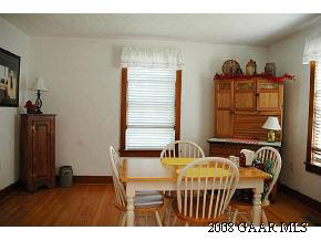 614 Battlefield Road New Hope, VA 24437 - Photo 7 of 12 a view of a dining room with furniture and wooden floor