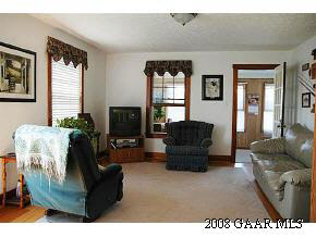 614 Battlefield Road New Hope, VA 24437 - Photo 8 of 12 a living room with furniture and a flat screen tv