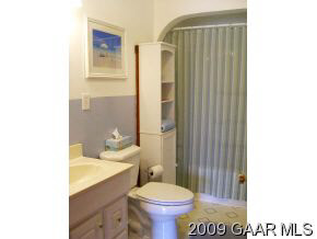 614 Battlefield Road New Hope, VA 24437 - Photo 9 of 12 a bathroom with a sink toilet and shower