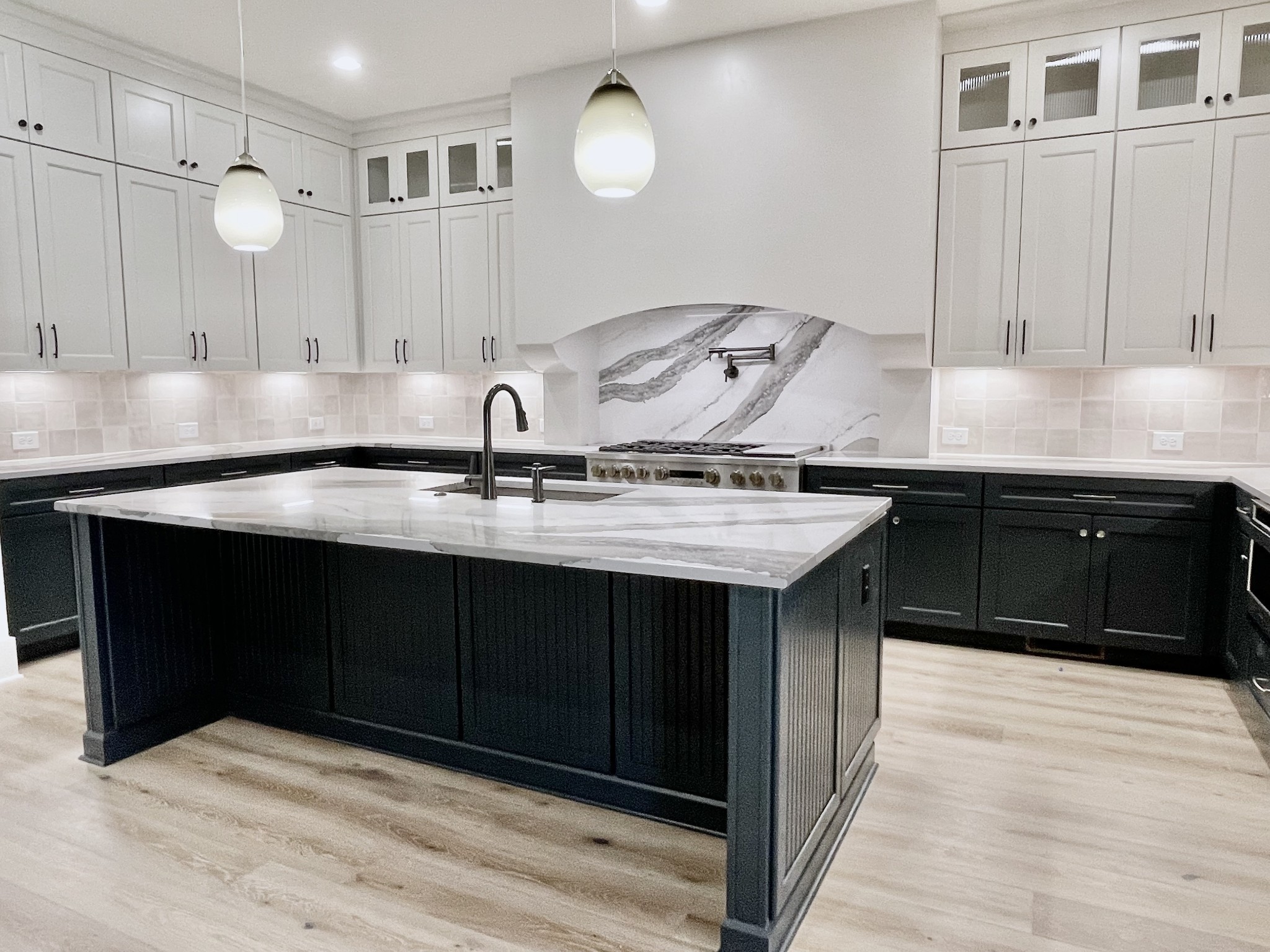 9914 Elland Road Brentwood, TN 37027 - Photo 34 of 64 a kitchen with a sink cabinets and wooden floor