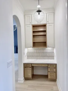 a spacious bathroom with a granite countertop sink mirror and a