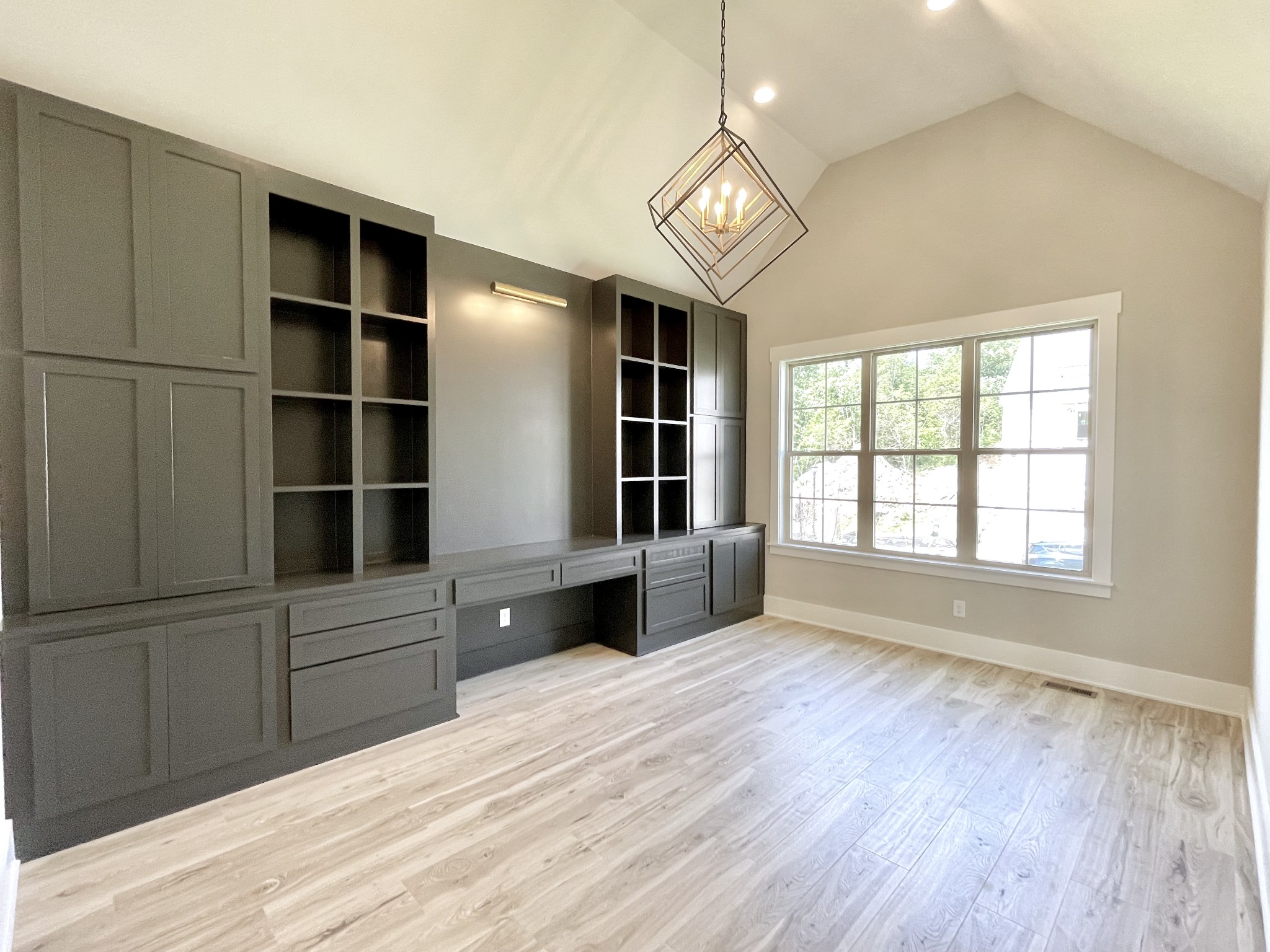 9914 Elland Road Brentwood, TN 37027 - Photo 6 of 64 a view of an empty room with a window and wooden floor