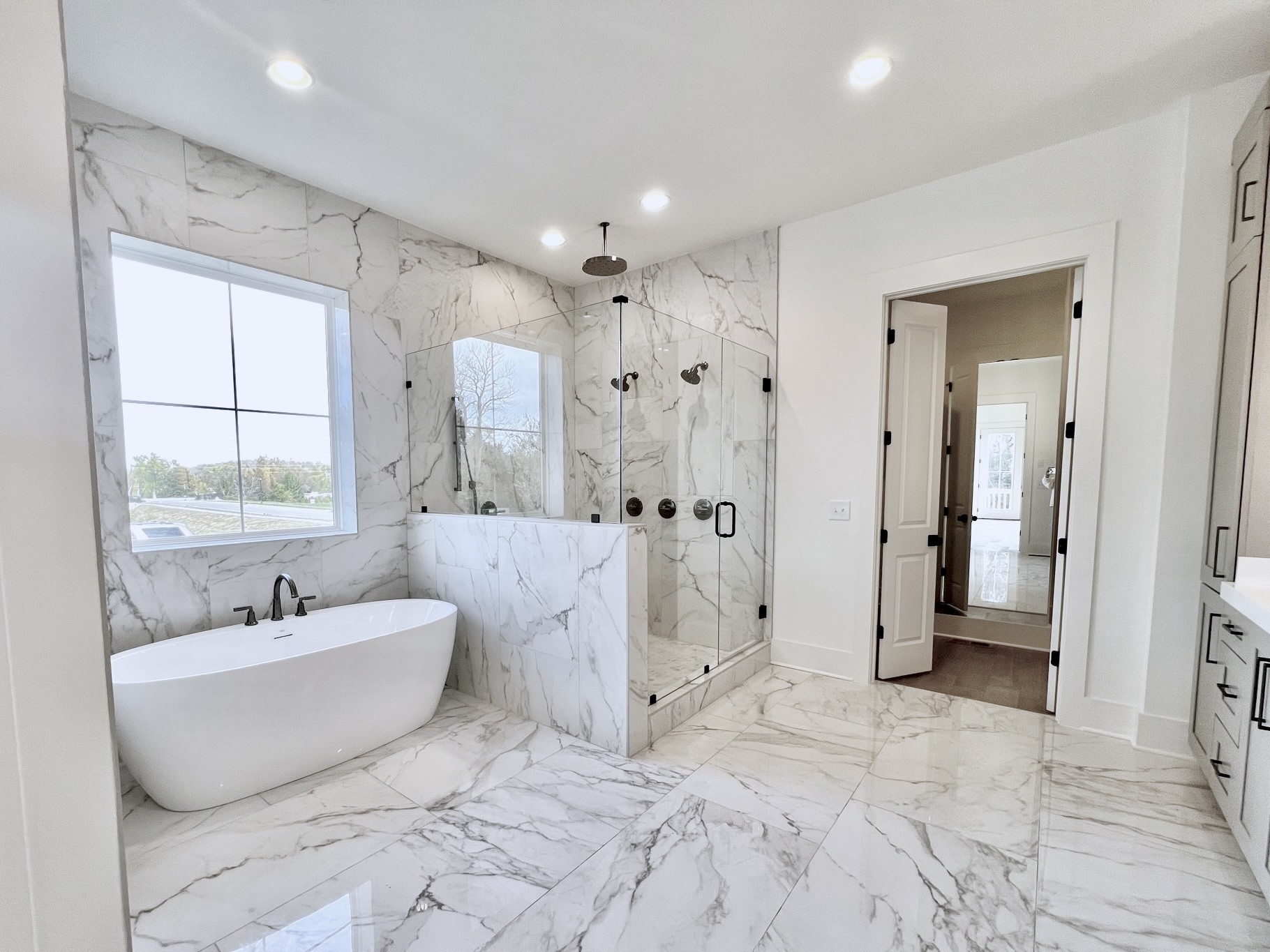 9914 Elland Road Brentwood, TN 37027 - Photo 64 of 64 a spacious bathroom with a double vanity sink a mirror and a bathtub