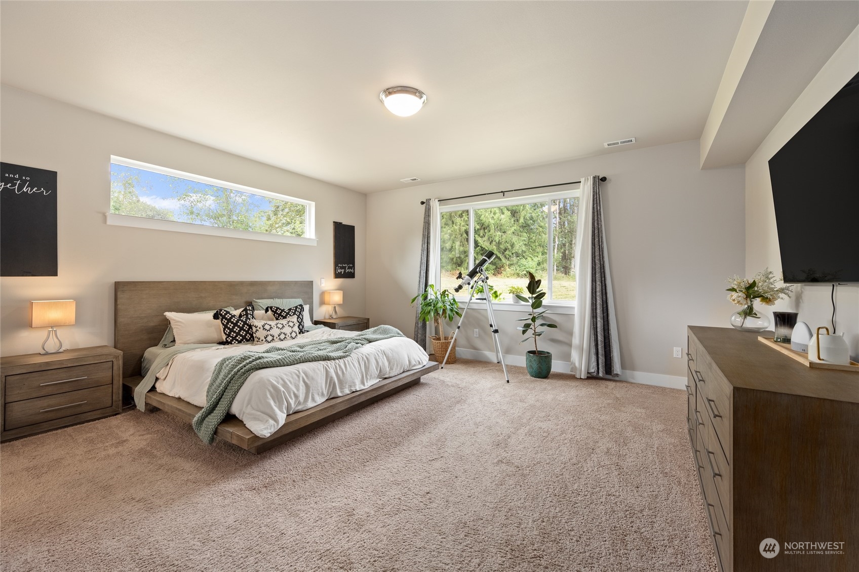 3522 Creswell Road Snohomish, WA 98290 - Photo 19 of 40 a spacious bedroom with a bed and a flat screen tv