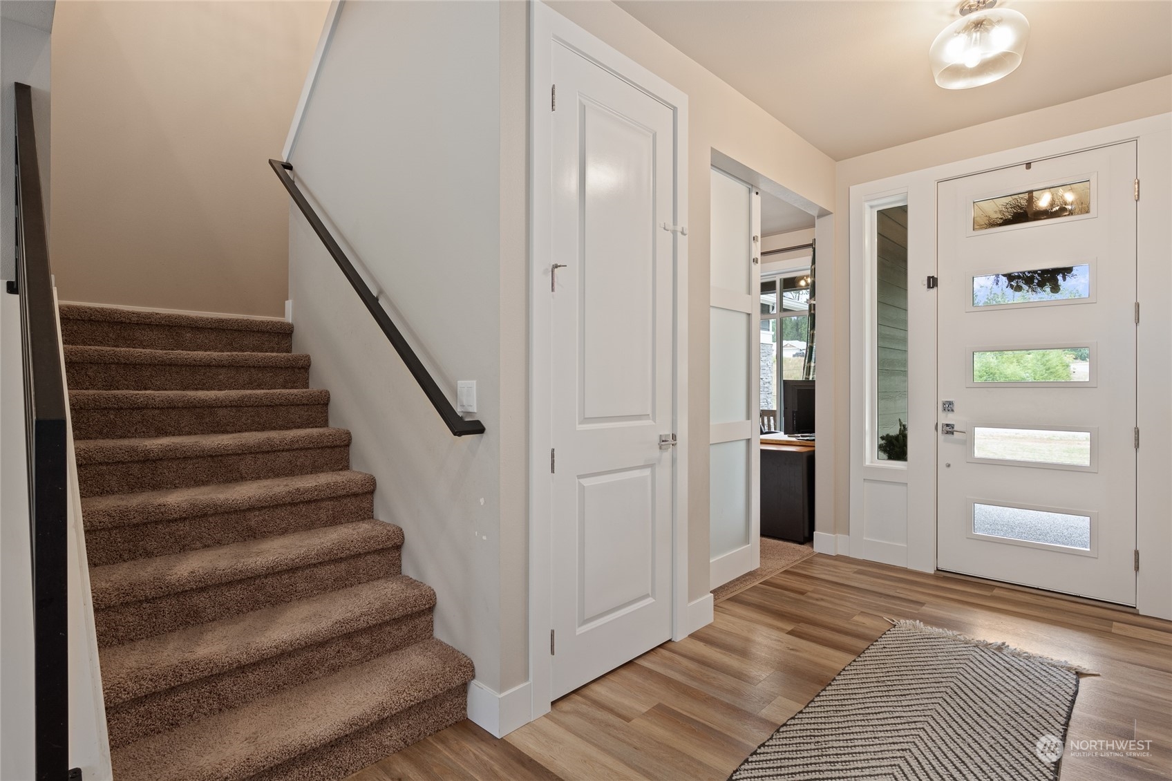 3522 Creswell Road Snohomish, WA 98290 - Photo 24 of 40 a view of a bedroom with wooden floor and stairs