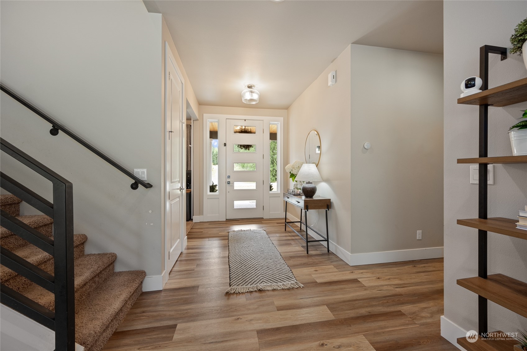 3522 Creswell Road Snohomish, WA 98290 - Photo 7 of 40 a view of a hallway view with wooden floor and staircase