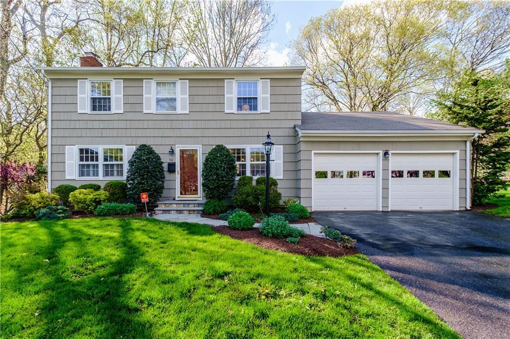 50 Drumm Road Fairfield, CT 06824 - Photo 1 of 1 a front view of a house with a yard and garage