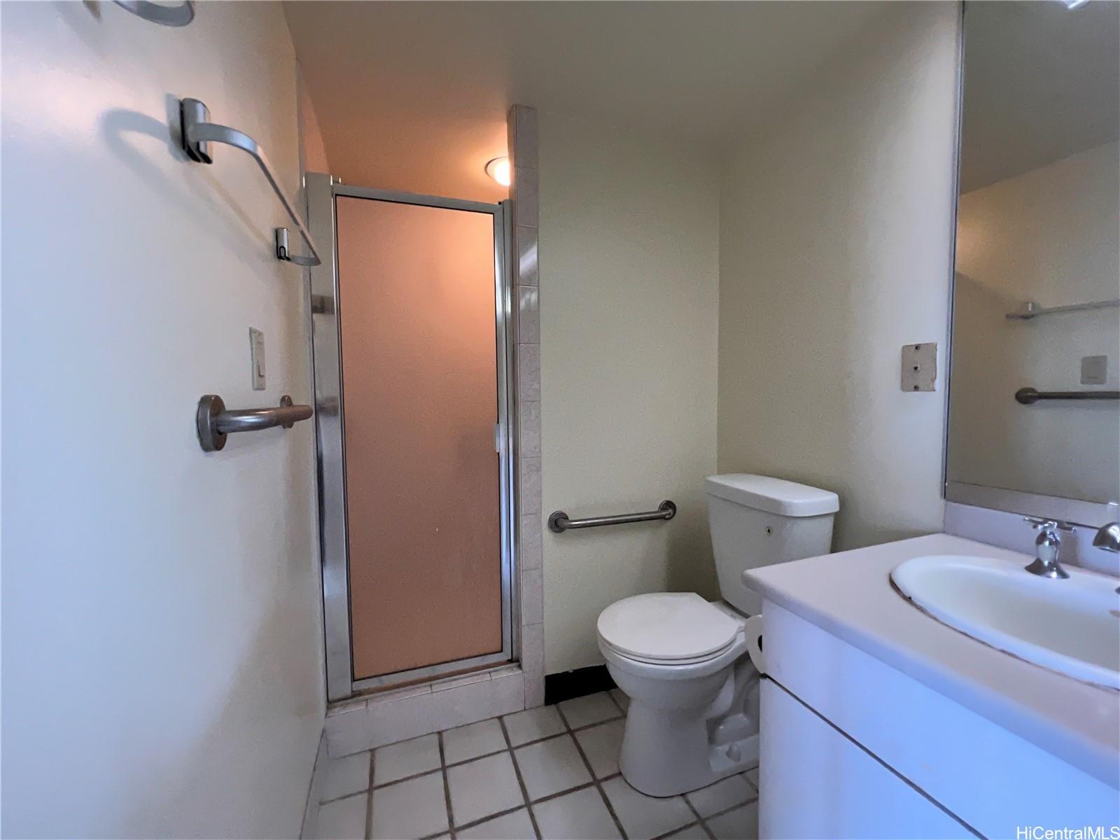 1860 Ala Moana Boulevard, Unit 902B Honolulu, HI 96815 - Photo 12 of 15 a bathroom with a sink a toilet and a shower