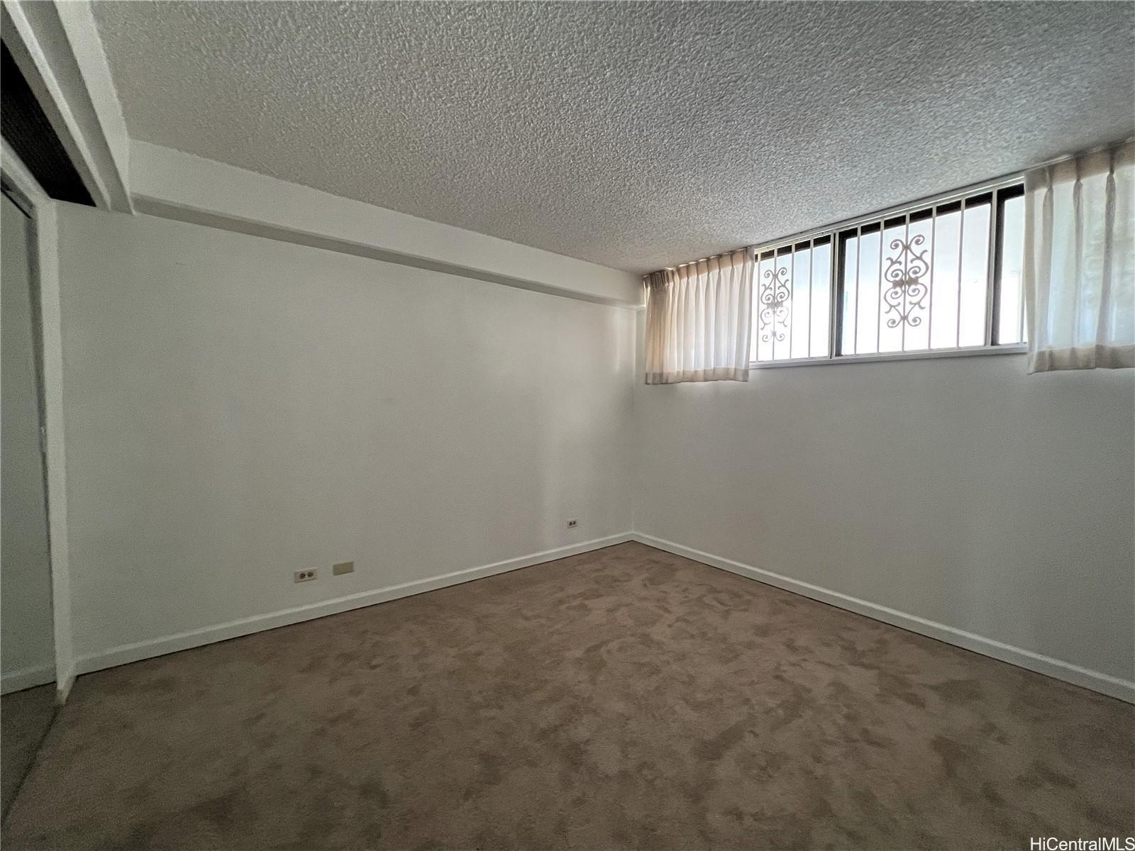 1860 Ala Moana Boulevard, Unit 902B Honolulu, HI 96815 - Photo 13 of 15 a view of an empty room with a window