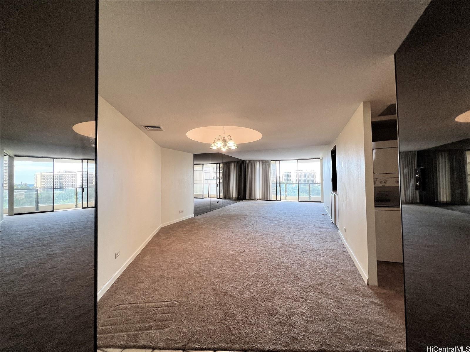 1860 Ala Moana Boulevard, Unit 902B Honolulu, HI 96815 - Photo 5 of 15 a view of a hallway with wooden floor and windows