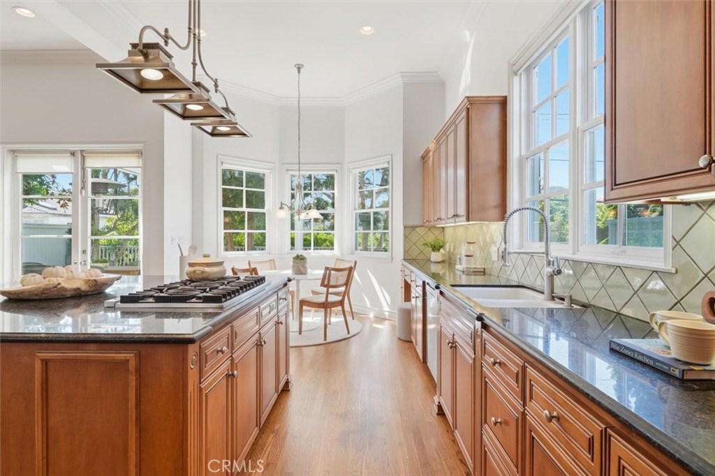 2909 Maple Avenue Manhattan Beach, CA 90266 - Photo 21 of 57 a kitchen with stainless steel appliances granite countertop a sink stove and cabinets