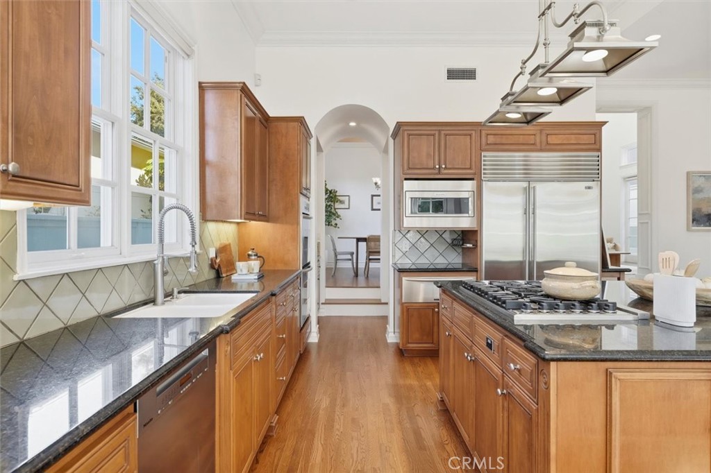 2909 Maple Avenue Manhattan Beach, CA 90266 - Photo 27 of 57 a kitchen with stainless steel appliances granite countertop a sink stove and refrigerator