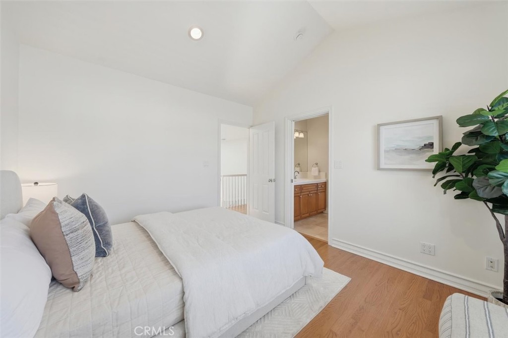 2909 Maple Avenue Manhattan Beach, CA 90266 - Photo 46 of 57 a bedroom with a bed and a potted plant
