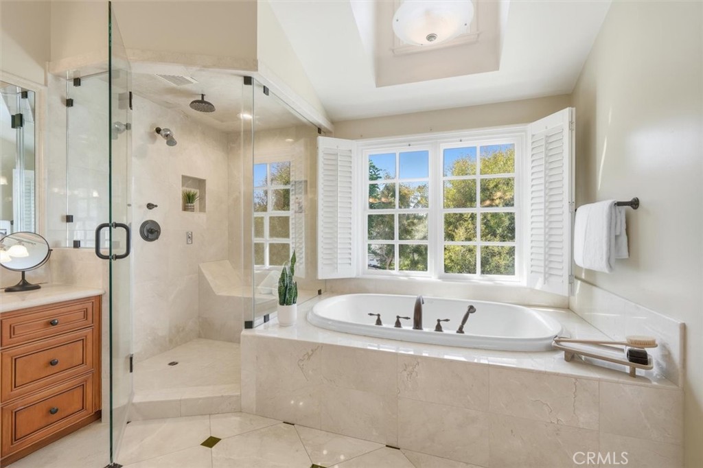 2909 Maple Avenue Manhattan Beach, CA 90266 - Photo 54 of 57 a bathroom with a granite countertop tub sink and mirror
