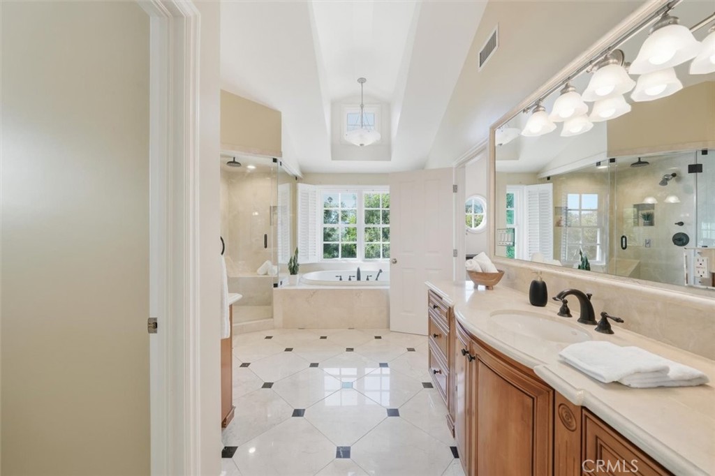 2909 Maple Avenue Manhattan Beach, CA 90266 - Photo 55 of 57 a bathroom with a granite countertop sink mirror and a bathtub
