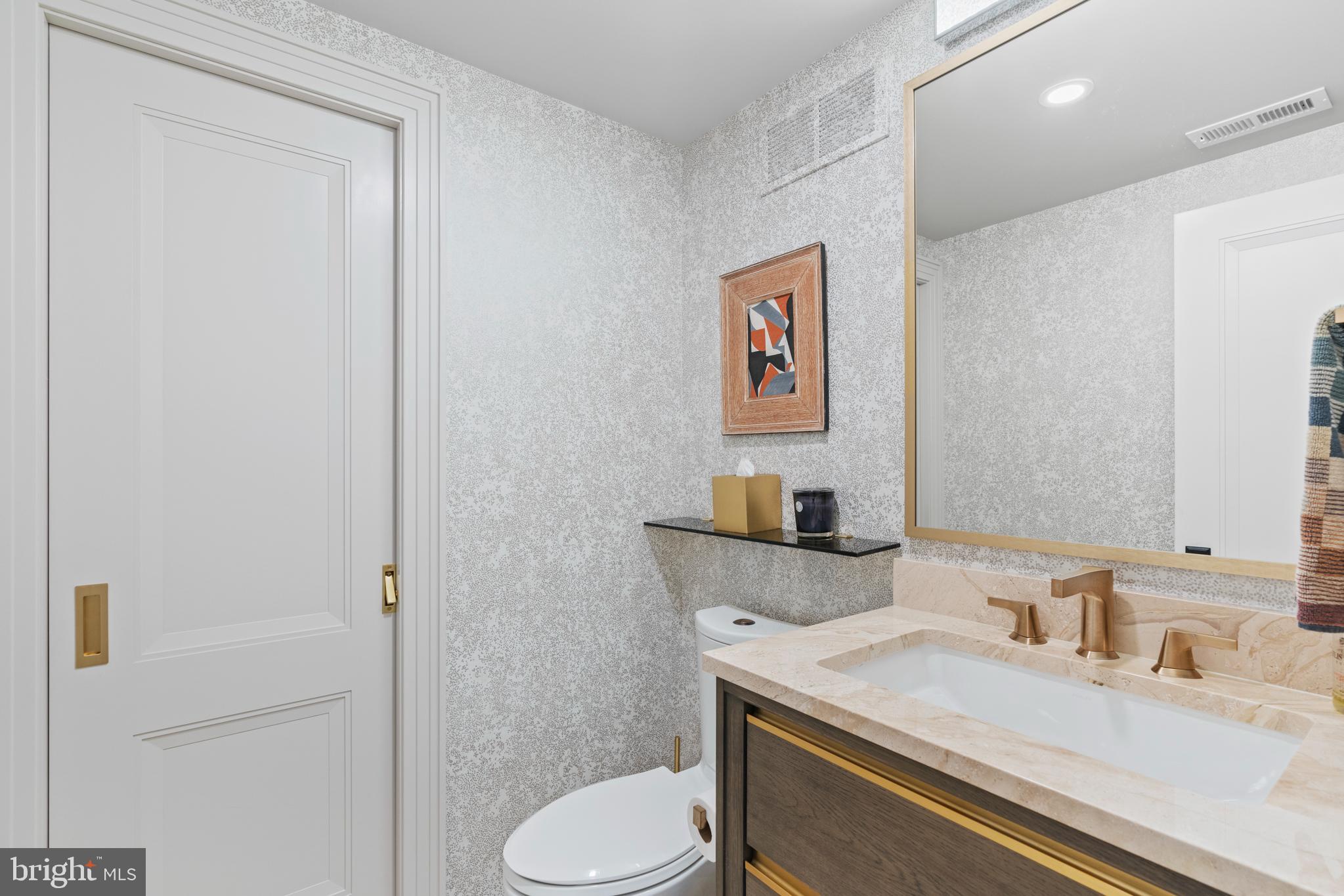 3323 R Street Northwest Washington, DC 20007 - Photo 49 of 54 Pocket door in full bath #3, wallpaper by ROMO®.