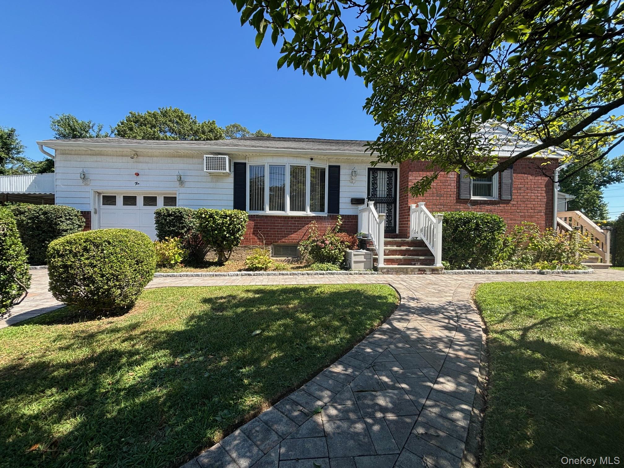 10 13th Avenue West Babylon, NY 11704 - Photo 1 of 33 a front view of a house with a yard