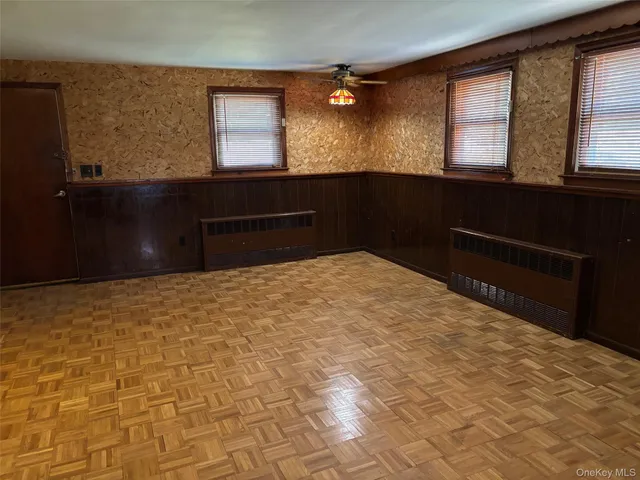 a bedroom with a bed dresser and a window