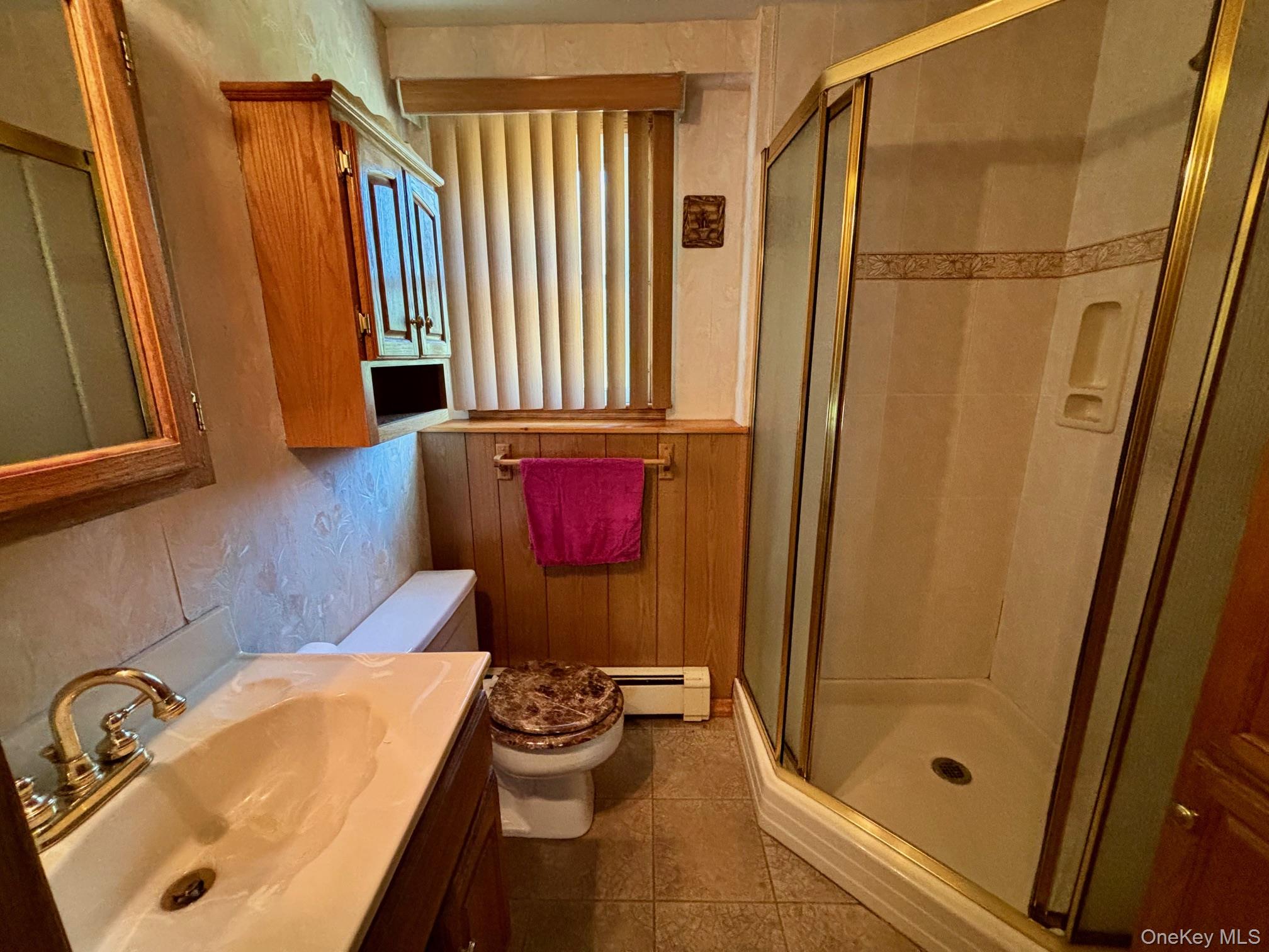 10 13th Avenue West Babylon, NY 11704 - Photo 20 of 33 a bathroom with a sink toilet and shower