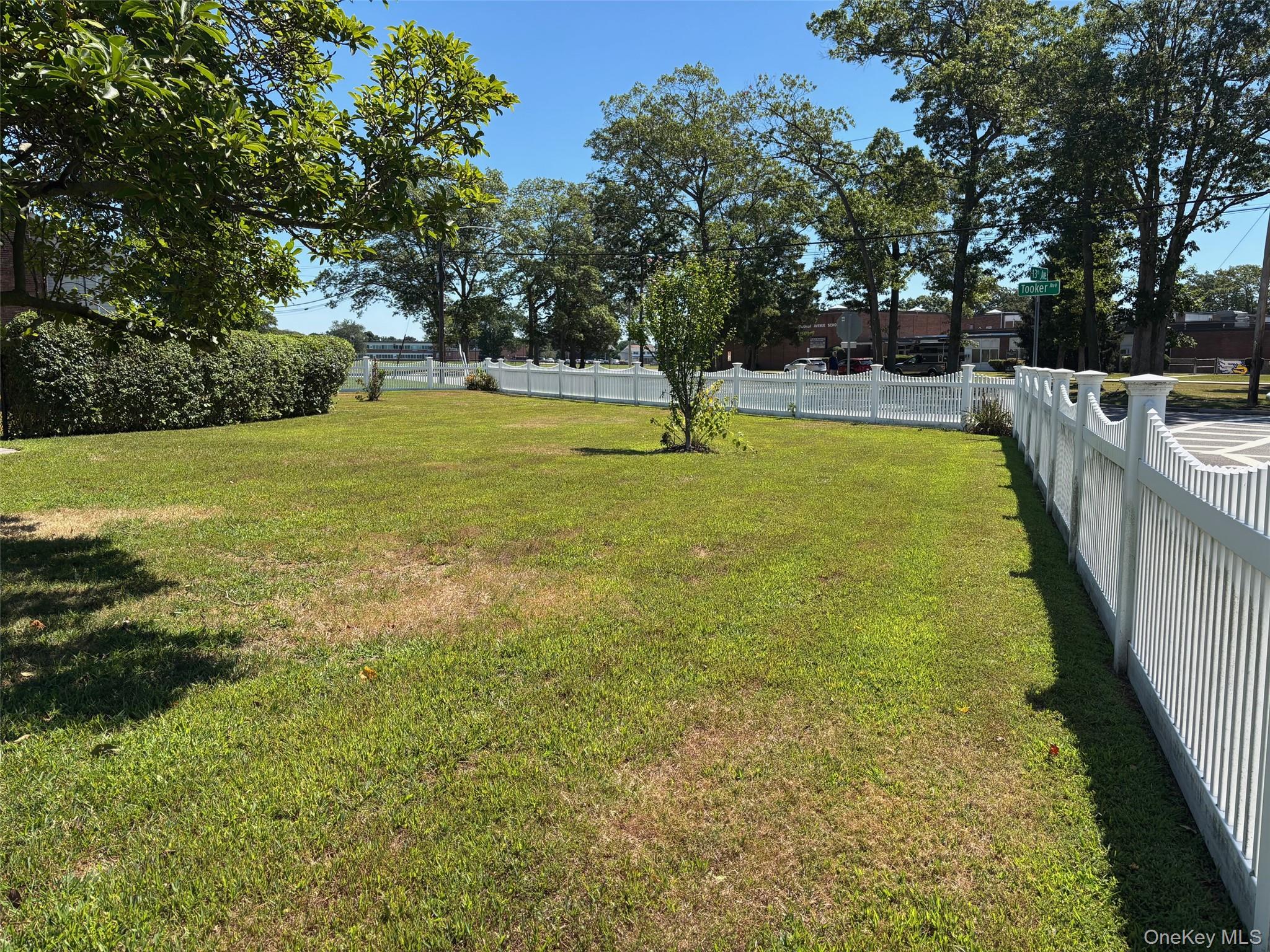 10 13th Avenue West Babylon, NY 11704 - Photo 26 of 33 a view of a swimming pool with a yard