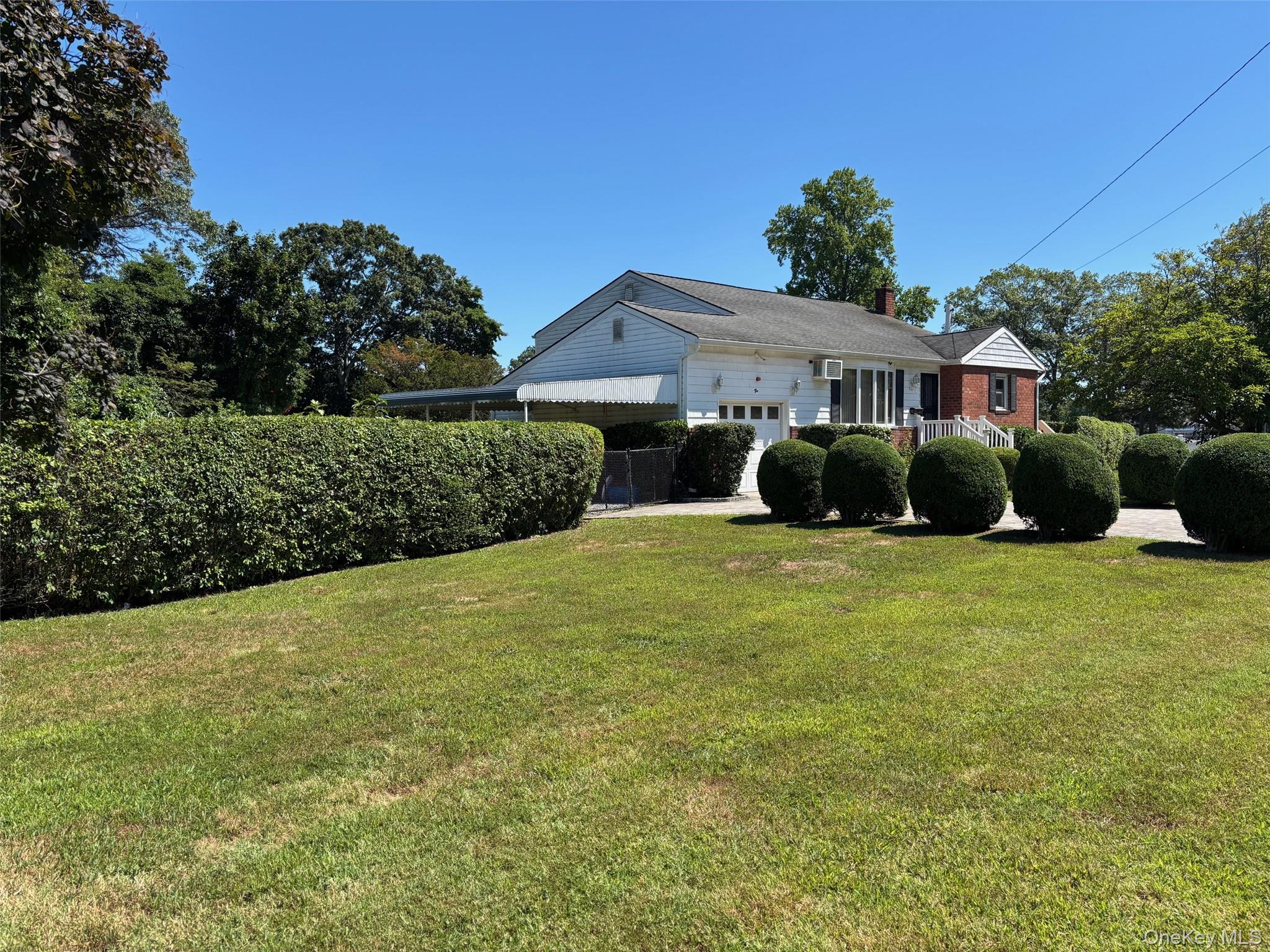 10 13th Avenue West Babylon, NY 11704 - Photo 27 of 33 a front view of a house with a yard