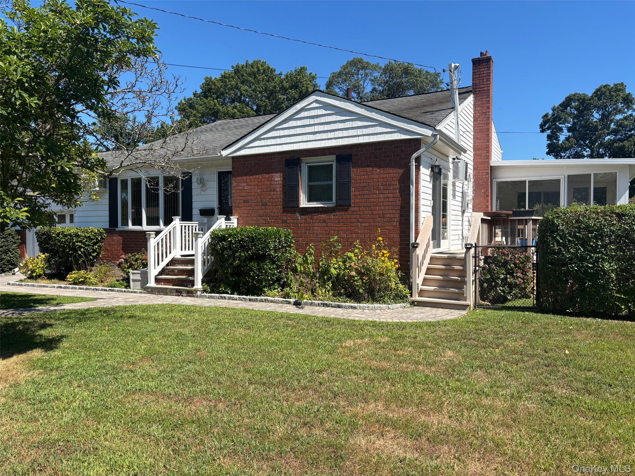 10 13th Avenue West Babylon, NY 11704 - Photo 28 of 33 a front view of a house with a yard
