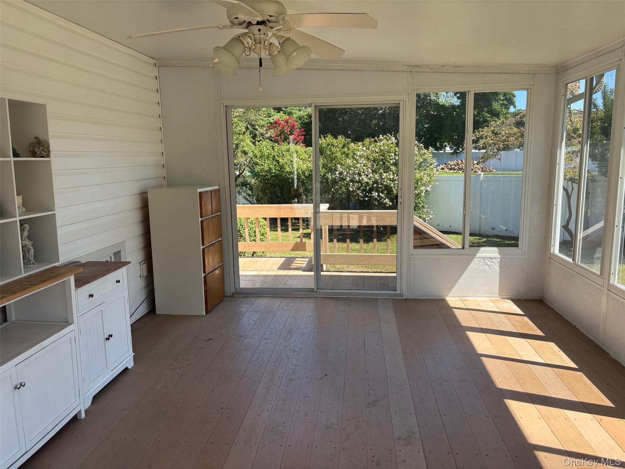 10 13th Avenue West Babylon, NY 11704 - Photo 30 of 33 wooden floor in an empty room with a window
