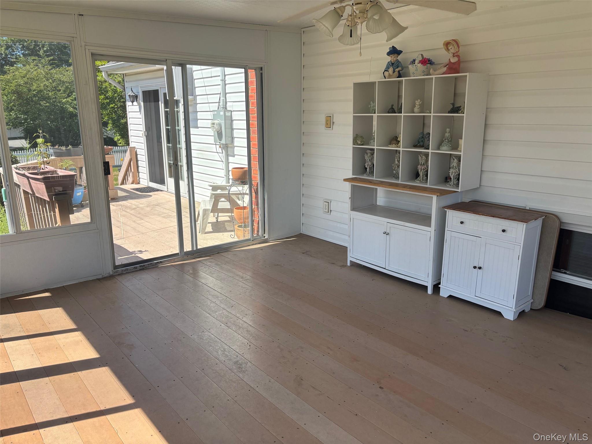 10 13th Avenue West Babylon, NY 11704 - Photo 31 of 33 an empty room with wooden floor and windows