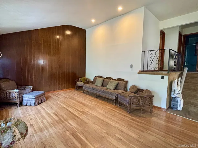 a spacious bedroom with a bed and a couch